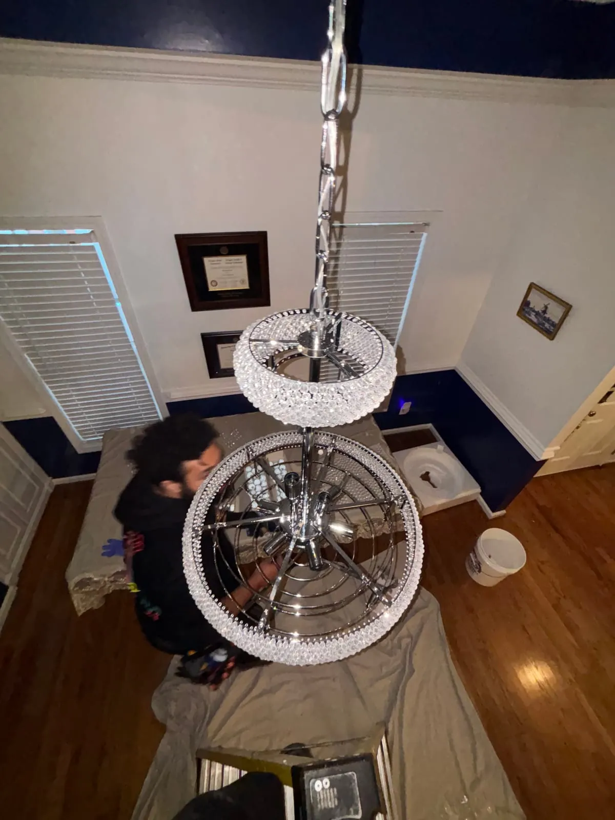 Hanging a chandelier in a two-story entry