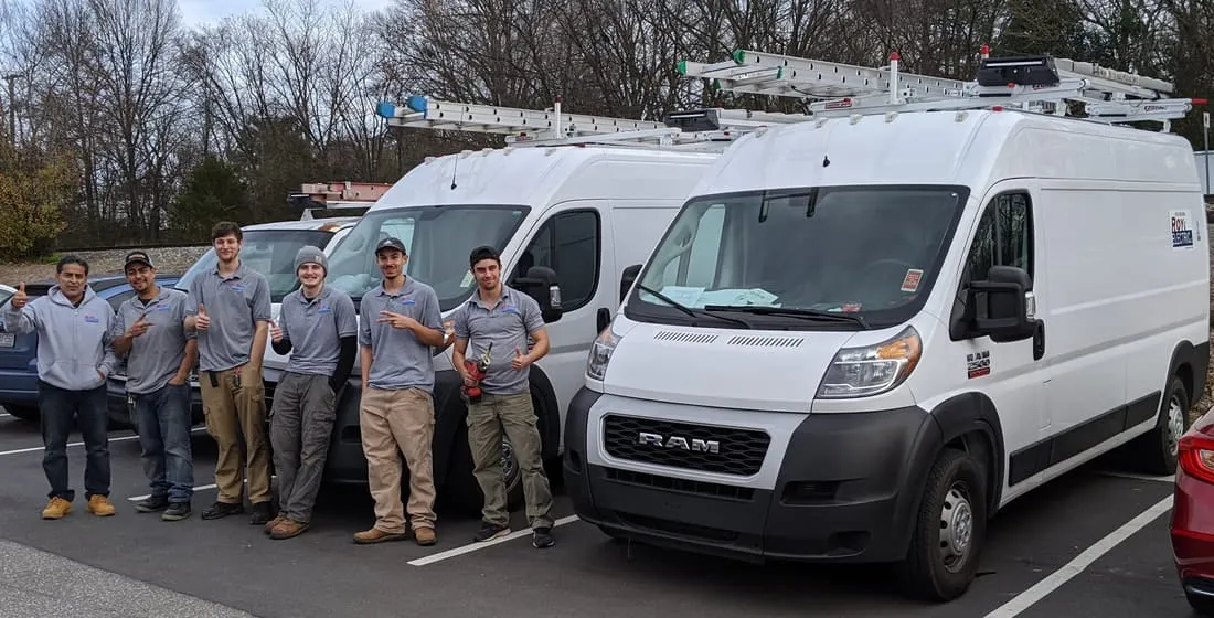 The Roy Electric team with their service vans