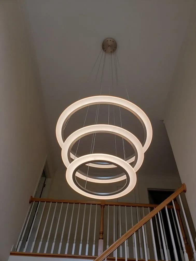 LED ring chandelier in a two-story foyer